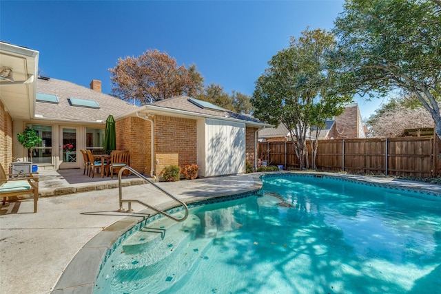 view of pool featuring a patio area, fence, and a fenced in pool