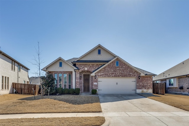 view of front of home with a garage, driveway, fence, and brick siding