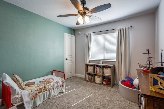 bedroom with carpet floors, ceiling fan, and baseboards