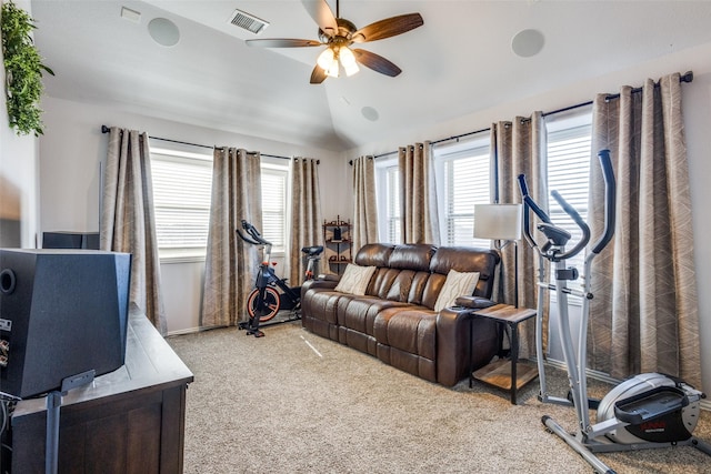 living room featuring a healthy amount of sunlight, visible vents, vaulted ceiling, and ceiling fan