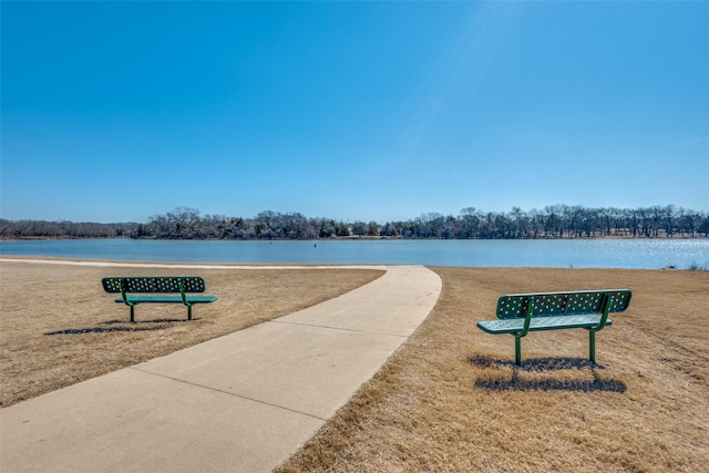 view of home's community with a water view