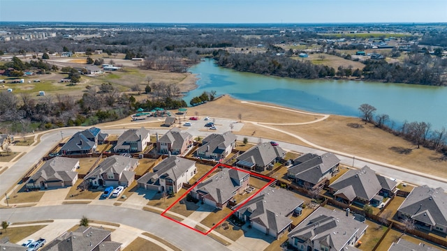 bird's eye view featuring a water view and a residential view