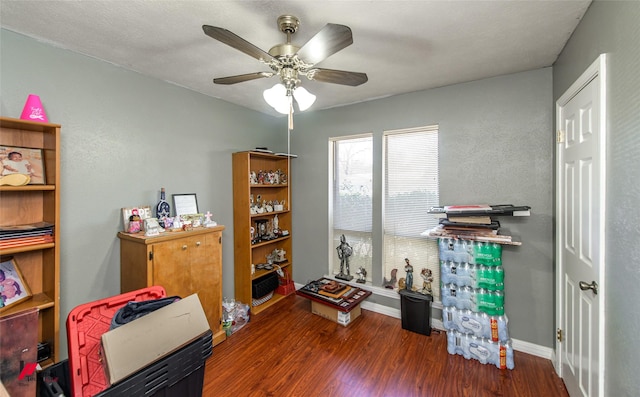 misc room featuring ceiling fan, baseboards, and wood finished floors