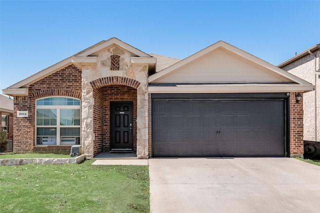 view of front of house with concrete driveway, brick siding, and an attached garage