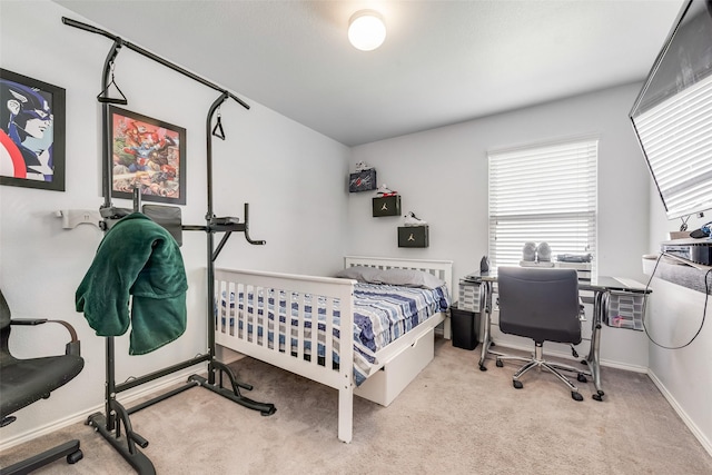 bedroom with carpet floors and baseboards