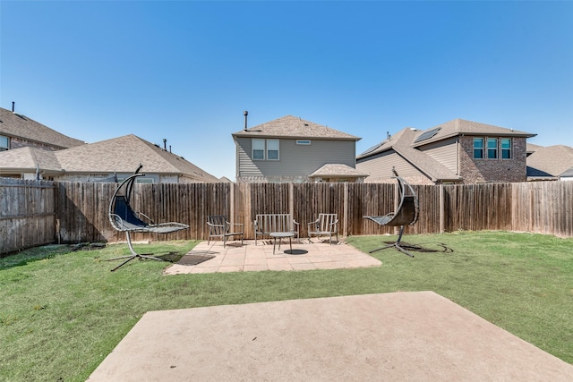 view of yard featuring a patio area and a fenced backyard