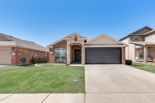 view of front of property featuring a garage, driveway, brick siding, and a front lawn