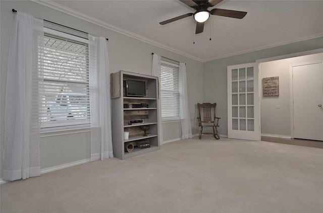 unfurnished room featuring baseboards, ornamental molding, and carpet flooring