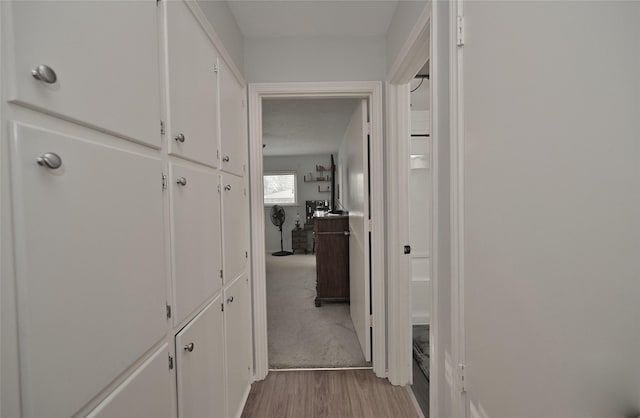 hallway with light wood-type flooring