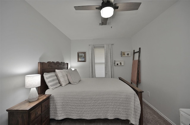 carpeted bedroom with ceiling fan and baseboards