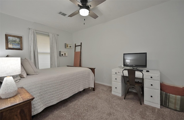 bedroom featuring light colored carpet, visible vents, and ceiling fan