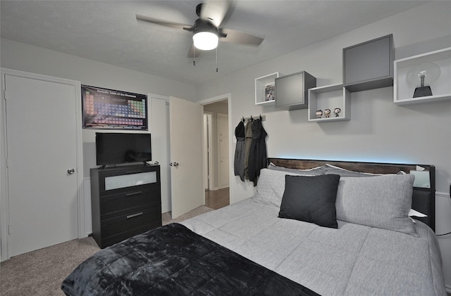 bedroom with ceiling fan and carpet flooring