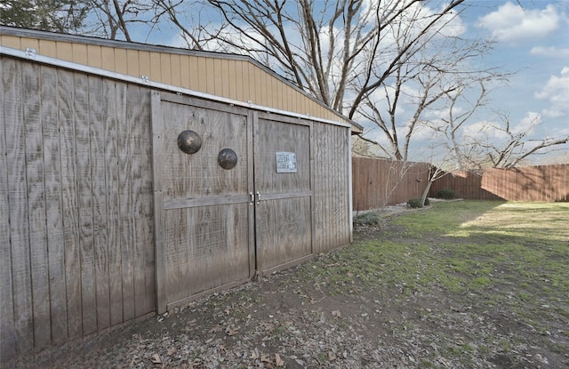 view of shed with a fenced backyard