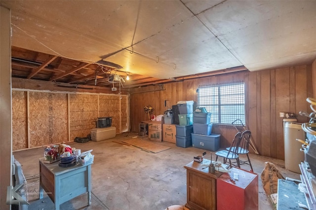 below grade area featuring a garage and wooden walls