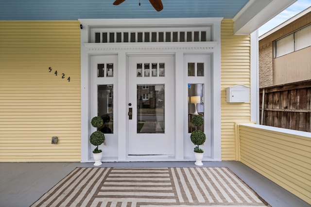 doorway to property with a ceiling fan