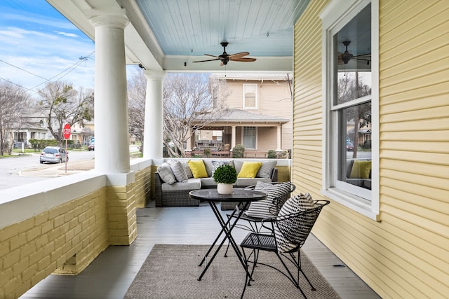 view of patio featuring ceiling fan and a porch