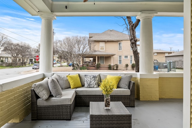 balcony featuring a porch, a residential view, and outdoor lounge area