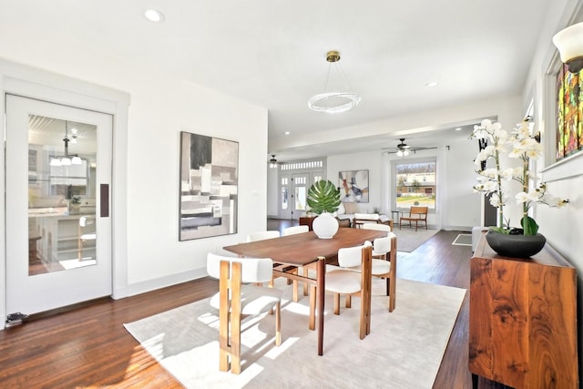 dining space with a ceiling fan, recessed lighting, baseboards, and wood finished floors