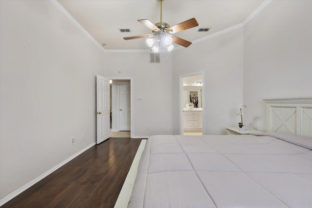 unfurnished bedroom featuring visible vents, wood finished floors, and ornamental molding