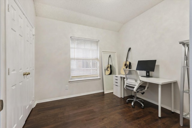 home office featuring vaulted ceiling, a textured ceiling, wood finished floors, and baseboards