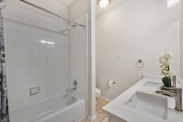 full bath featuring tile patterned flooring, a sink, toilet, and shower / tub combo with curtain