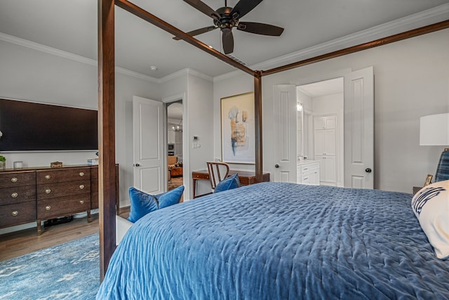 bedroom with ceiling fan, wood finished floors, and crown molding