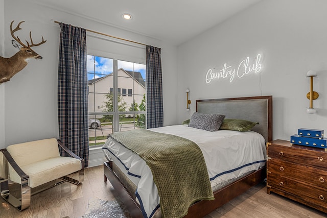 bedroom featuring wood finished floors and recessed lighting