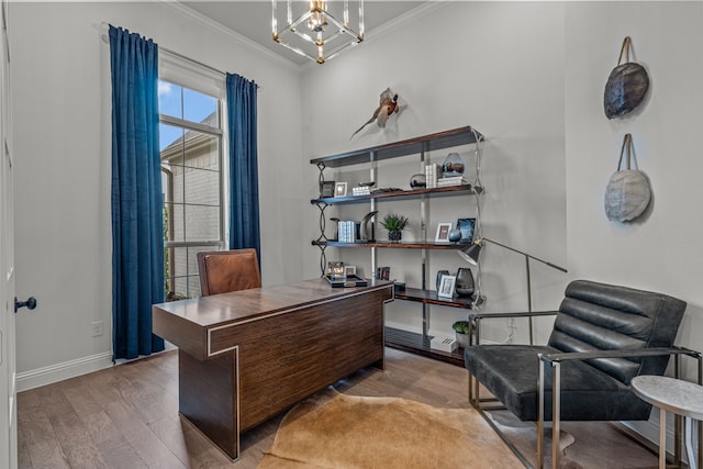 office space with an inviting chandelier, baseboards, ornamental molding, and wood finished floors