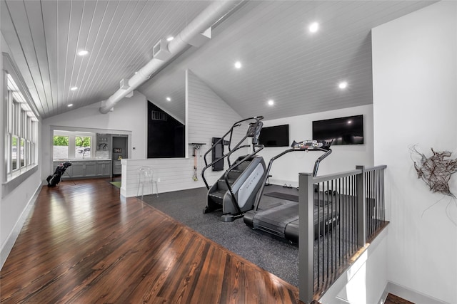 workout room with vaulted ceiling, recessed lighting, wood-type flooring, and baseboards