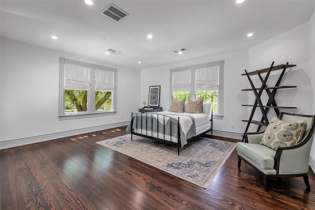 bedroom with visible vents, wood finished floors, and recessed lighting