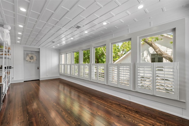 unfurnished sunroom featuring visible vents and a wealth of natural light