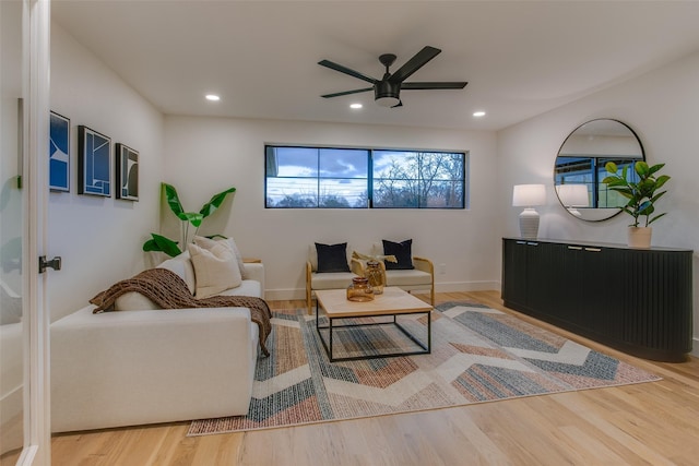 living room featuring baseboards, a ceiling fan, wood finished floors, and recessed lighting