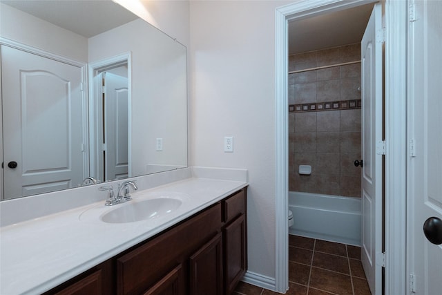 full bathroom featuring tile patterned flooring, toilet, vanity, and tub / shower combination