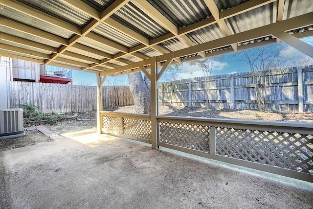 view of patio featuring cooling unit and fence