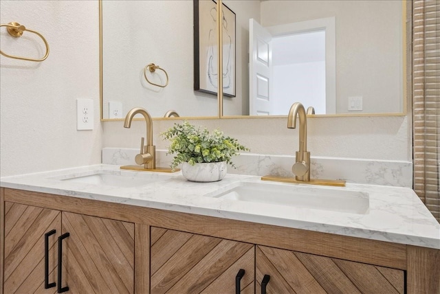 full bathroom featuring double vanity and a sink