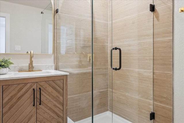 full bath featuring a stall shower and vanity