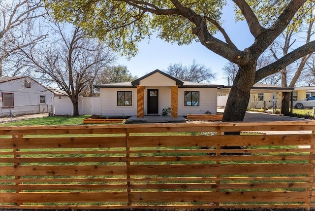 view of front of home with fence