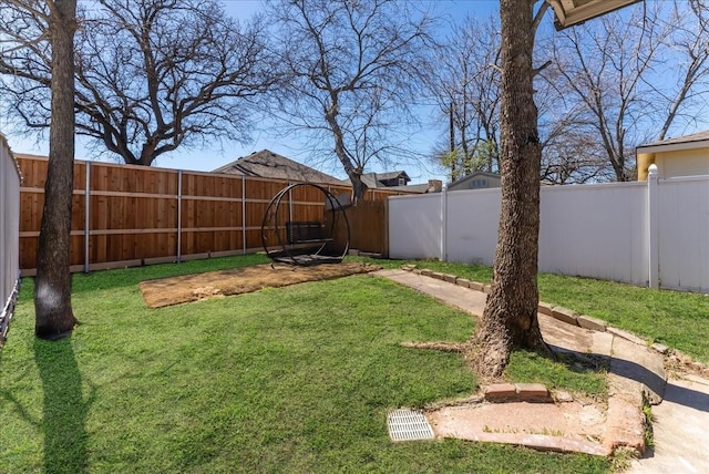 view of yard with a fenced backyard