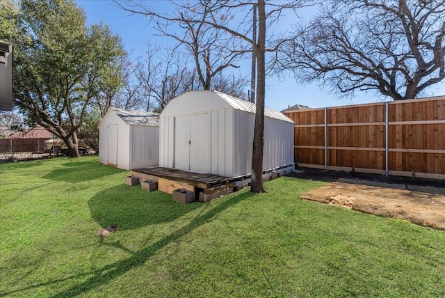 view of shed with a fenced backyard