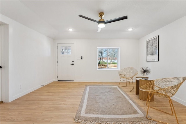 foyer entrance with light wood-style flooring, baseboards, a ceiling fan, and recessed lighting