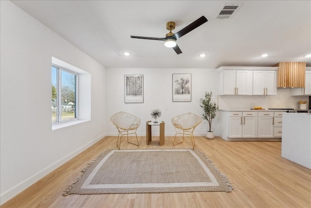 unfurnished room featuring light wood-style floors, recessed lighting, visible vents, and baseboards