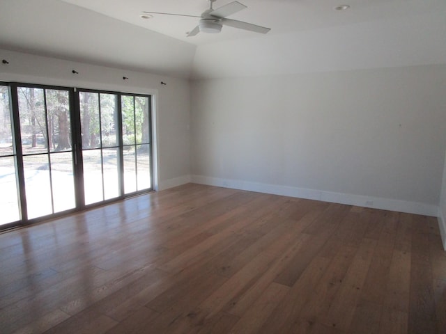 empty room with baseboards, lofted ceiling, ceiling fan, hardwood / wood-style floors, and recessed lighting