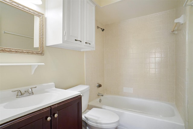 bathroom featuring toilet, vanity, and shower / bathing tub combination