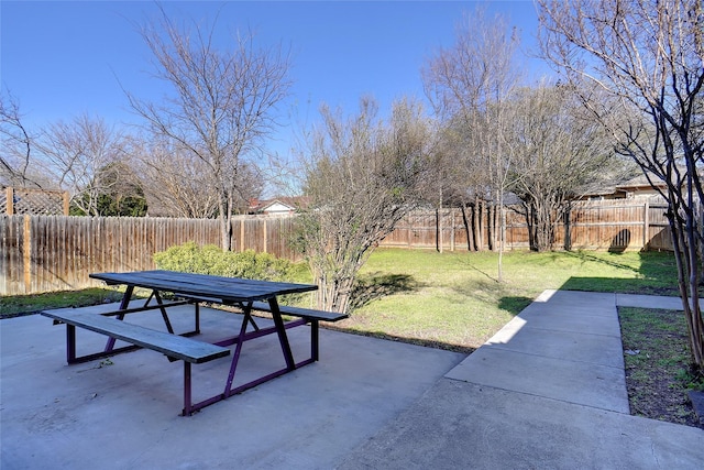 exterior space with a patio area, a fenced backyard, and outdoor dining area