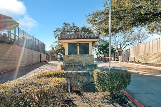 exterior space featuring a gate and fence