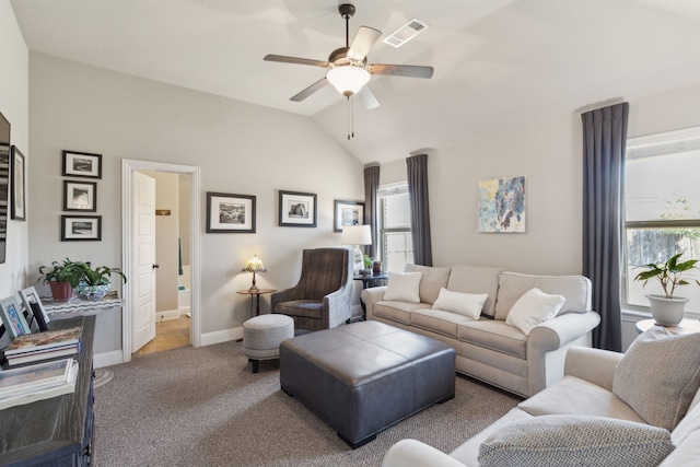 carpeted living room featuring visible vents, vaulted ceiling, baseboards, and ceiling fan