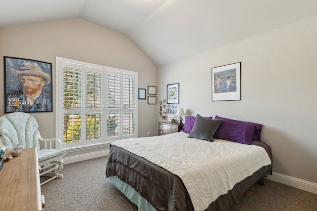 bedroom with lofted ceiling, carpet floors, and baseboards