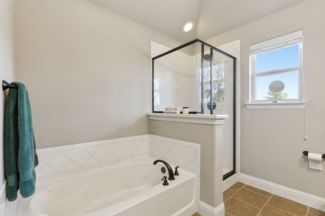 full bath with tile patterned flooring, a shower stall, a bath, and baseboards