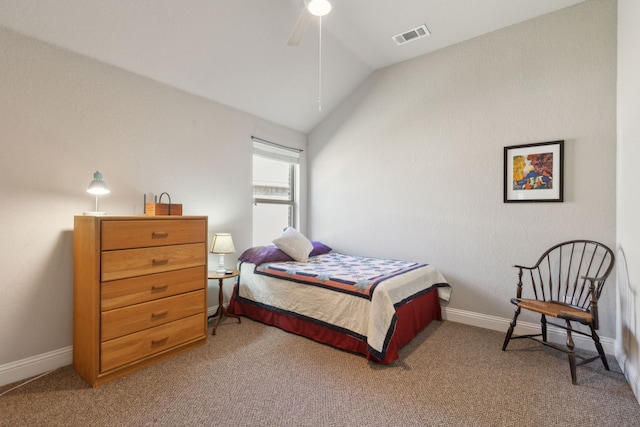 bedroom with vaulted ceiling, carpet flooring, visible vents, and baseboards