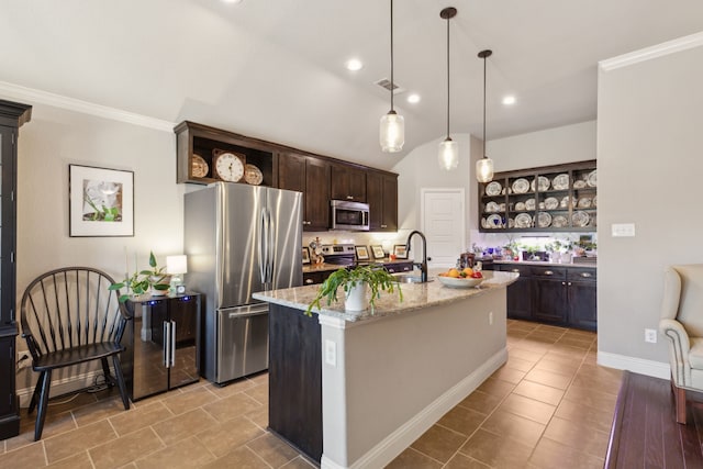 kitchen featuring appliances with stainless steel finishes, a kitchen island with sink, dark brown cabinetry, and open shelves